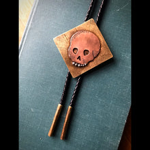 Load image into Gallery viewer, Memento Mori Skull Bolo Tie in Copper, Brass and Leather with Sterling Silver Teeth
